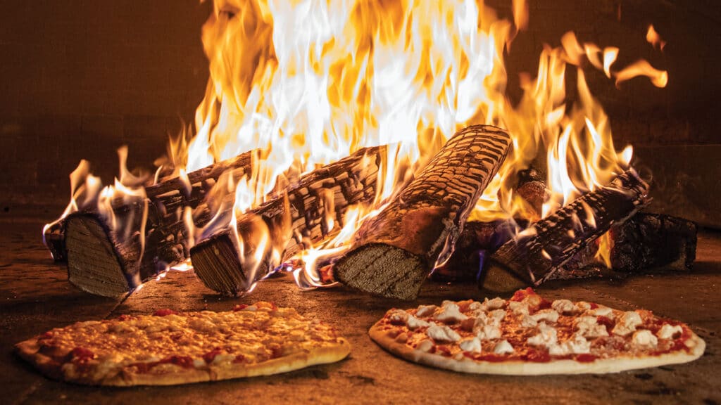 2 Bertucci's pizzas in the brick fire oven