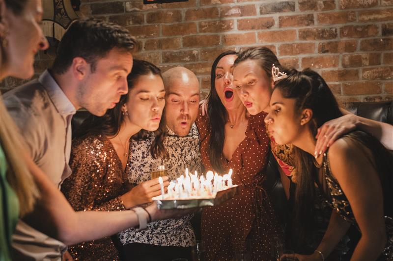 A family celebrating a birthday at Bertucci's!