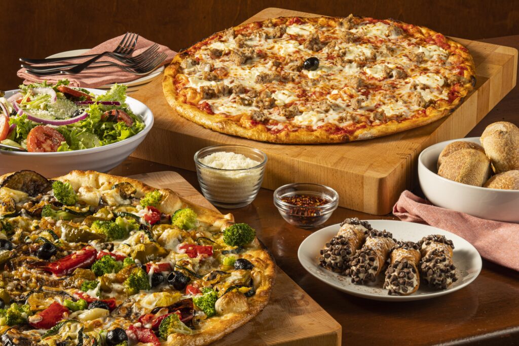 Pizzas, salad, and sides from Bertucci's