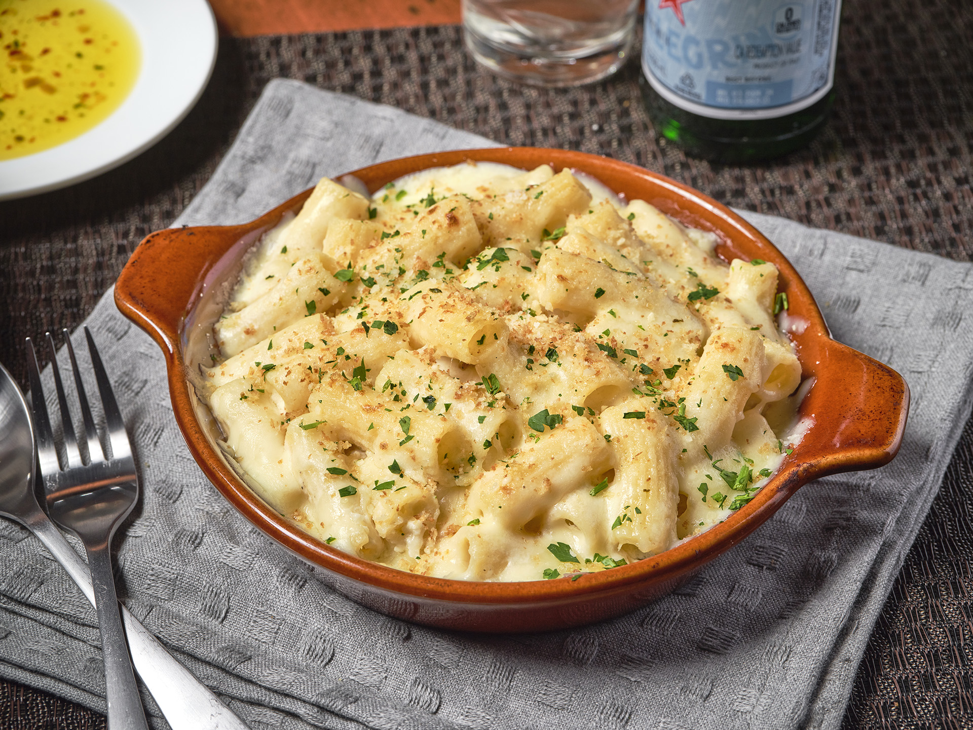A wood-fire-baked bowl of Mac & Cheese from Waltham