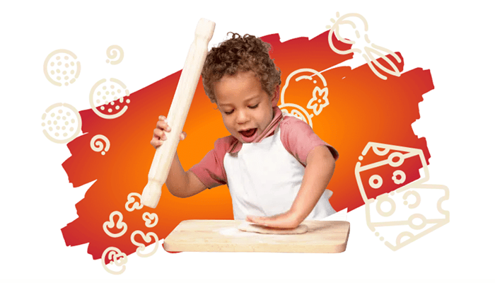 A kid making pizza at a Bertucci's little chef pizza party
