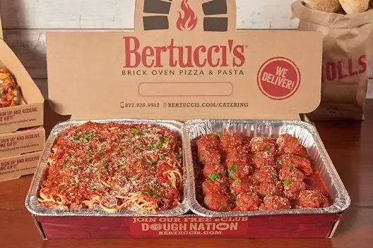 A catering tray of spaghetti & meatballs