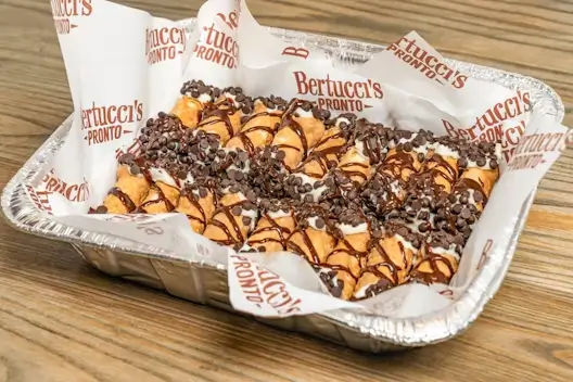A catering tray of traditional mini cannoli